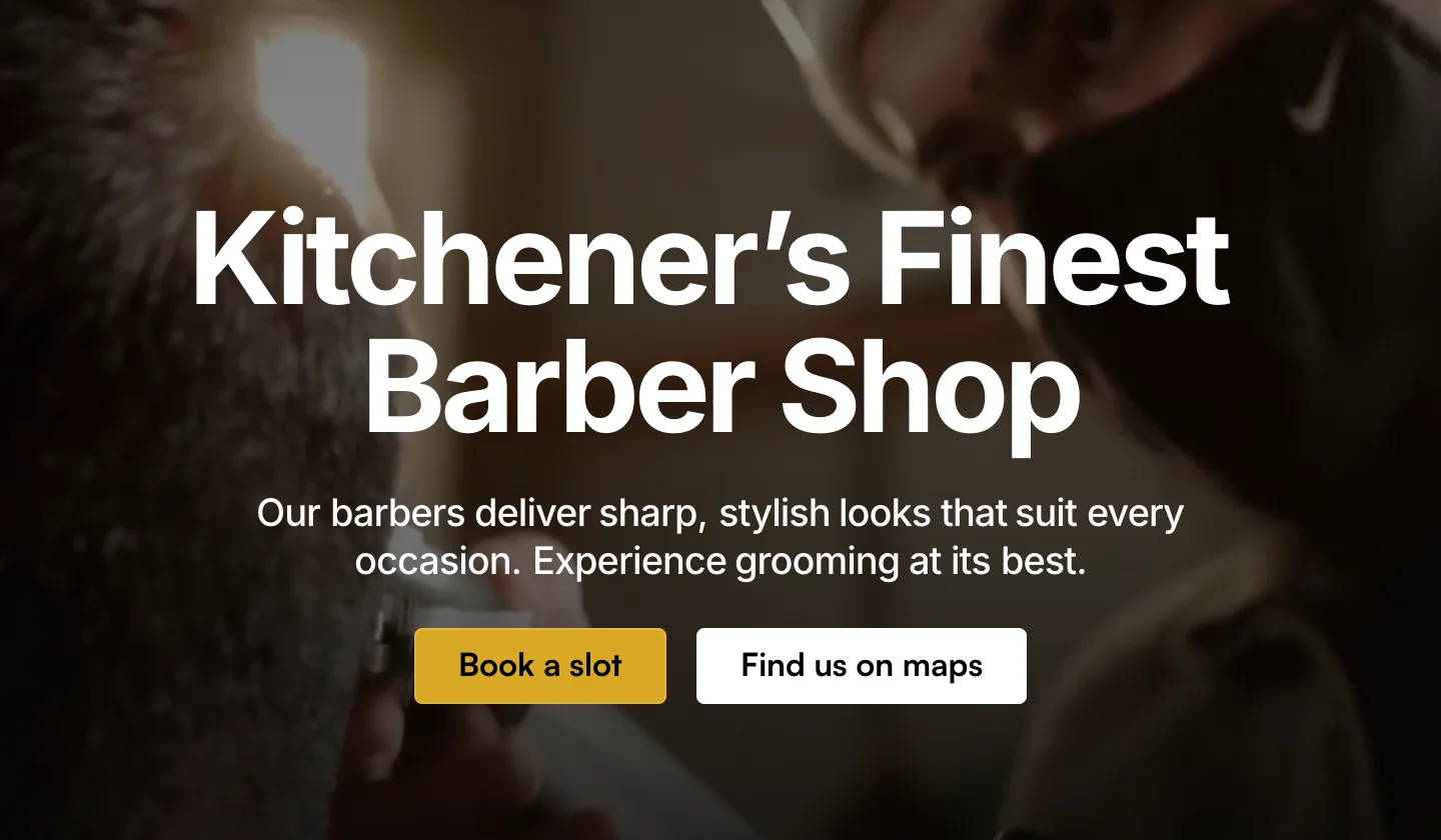Close crop of the published hero at 2x: Kitchener's Finest Barber Shop in white over the video still, the line Our barbers deliver sharp, stylish looks that suit every occasion, and the yellow Book a slot button beside Find us on maps.
