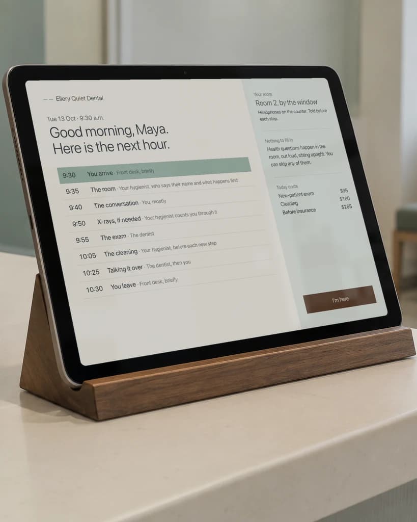 Studio concept, Ellery Quiet Dental: a tablet on a walnut stand at reception showing the next hour, minute by minute, with example prices.