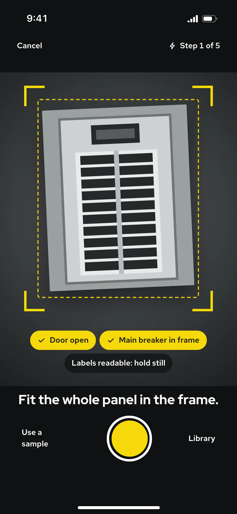 The photo-quote viewfinder: a breaker panel in a dark camera view, volt corner guides, checks reading Door open and Main breaker in frame, and the instruction Fit the whole panel in the frame.